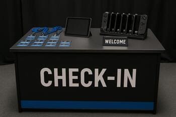 Compact check-in desk with badges and device rack