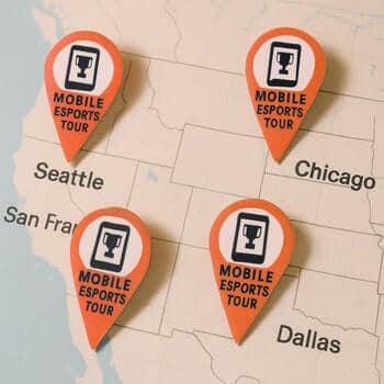 Printed city pins placed over a map